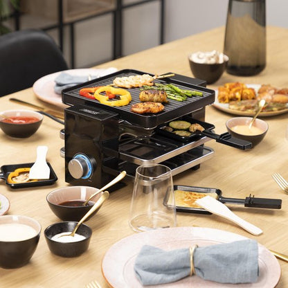 Princess Gourmetstel 162915 - Raclette Piano Black 4 personen – Parking deck voor gebruikte pannetjes – 2 meter snoer - 700W Tweede kans